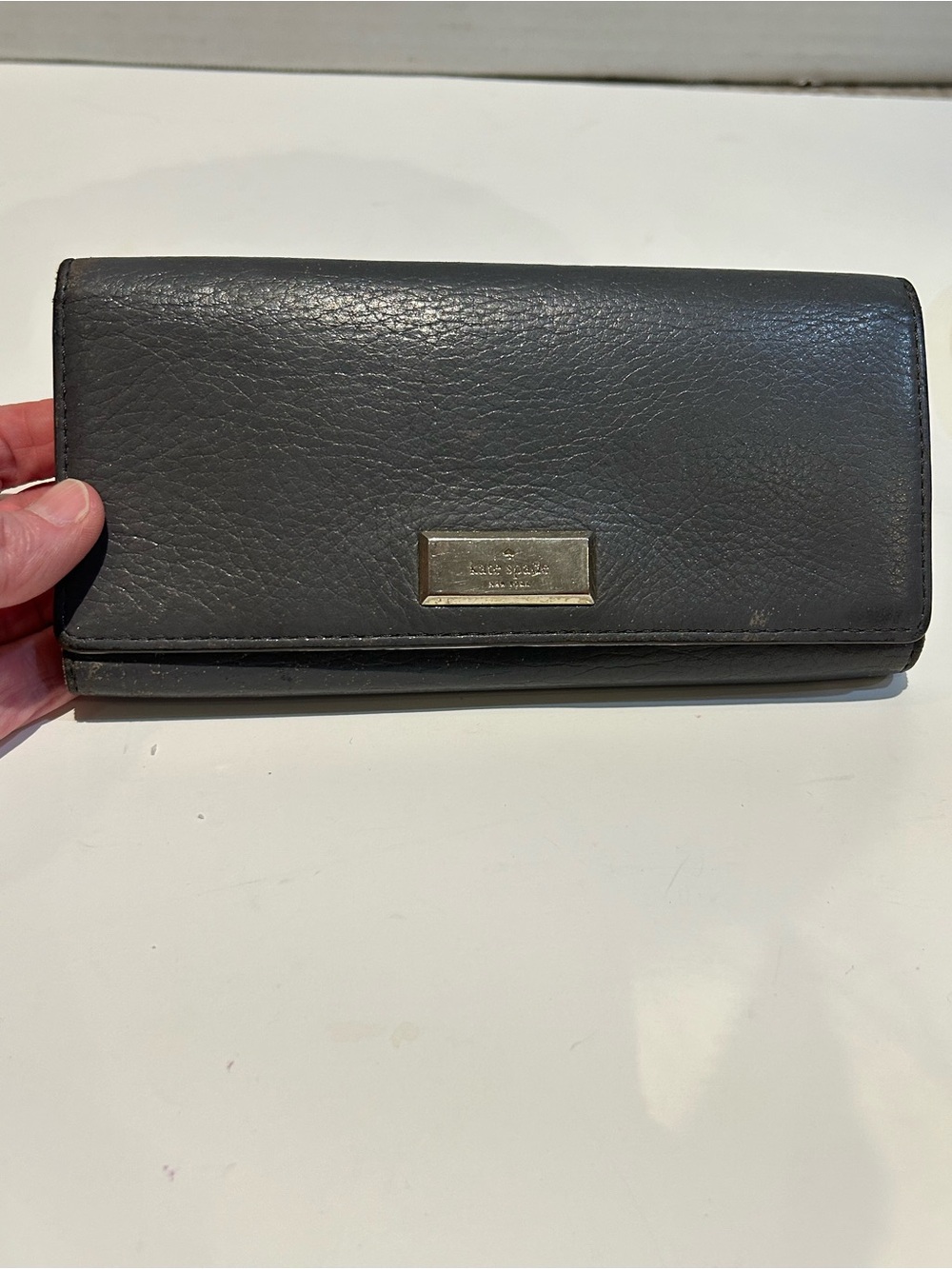 kate spade gray leather flap  wallet with white interior-